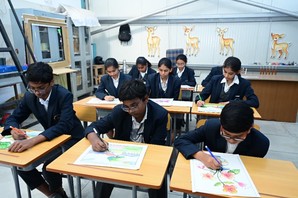 Students drawing and painting in art class at Lawrence High School