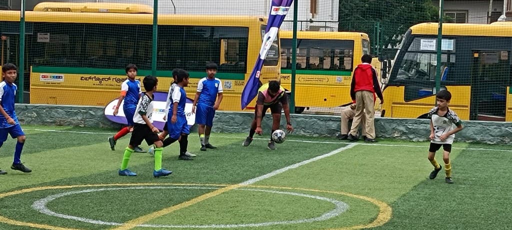 Students playing football on the turf at Lawrence High School
