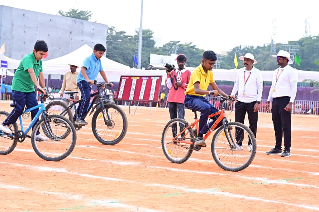 High school students cycling on sports day at Lawrence High School