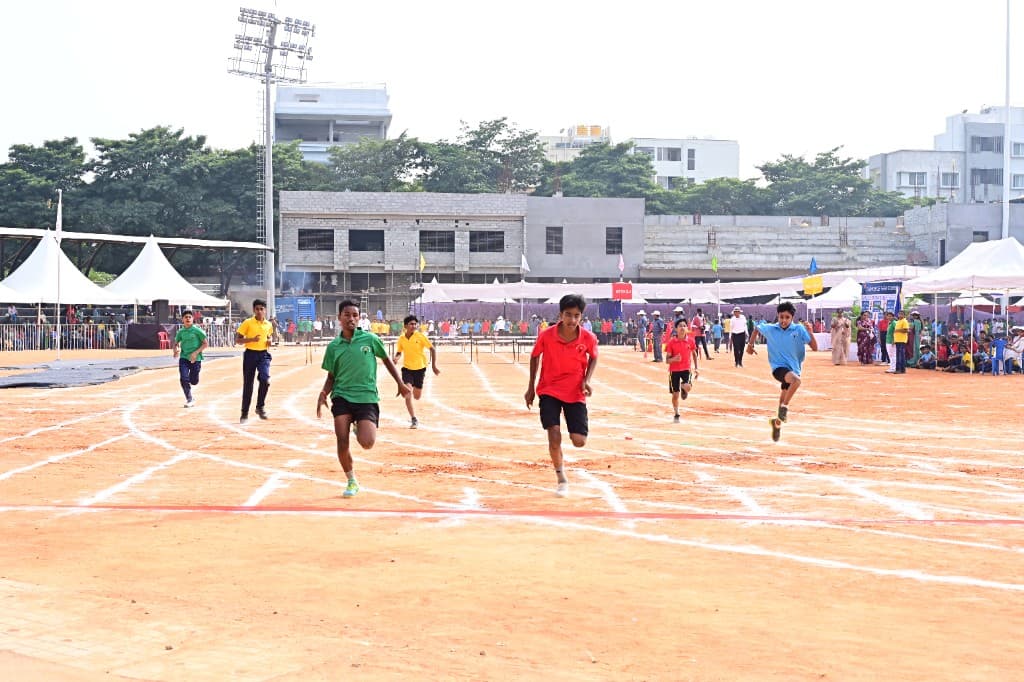 High school students running a track race at Lawrence High School