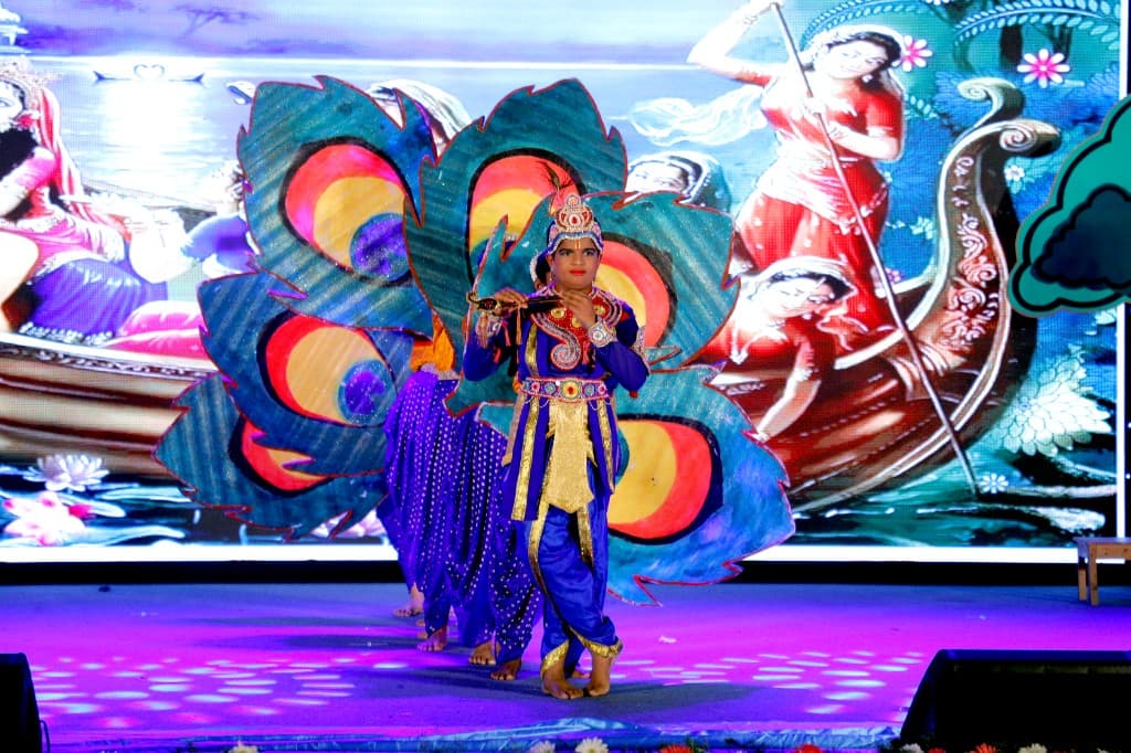 A high school student performing a classical dance at Lawrence High School