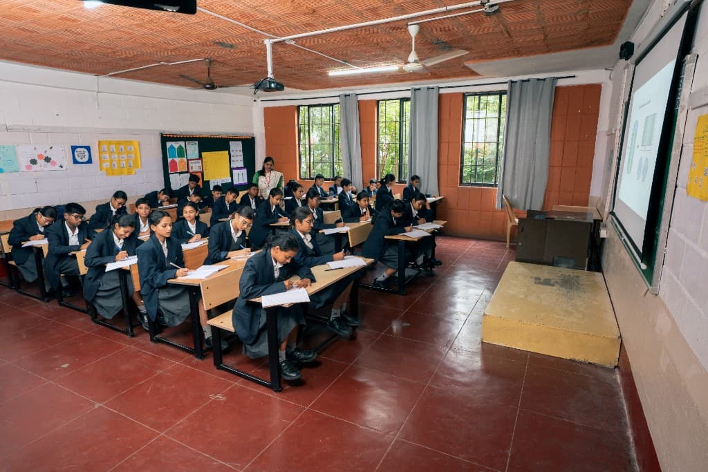 High school students working at their desks in class at Lawrence High School