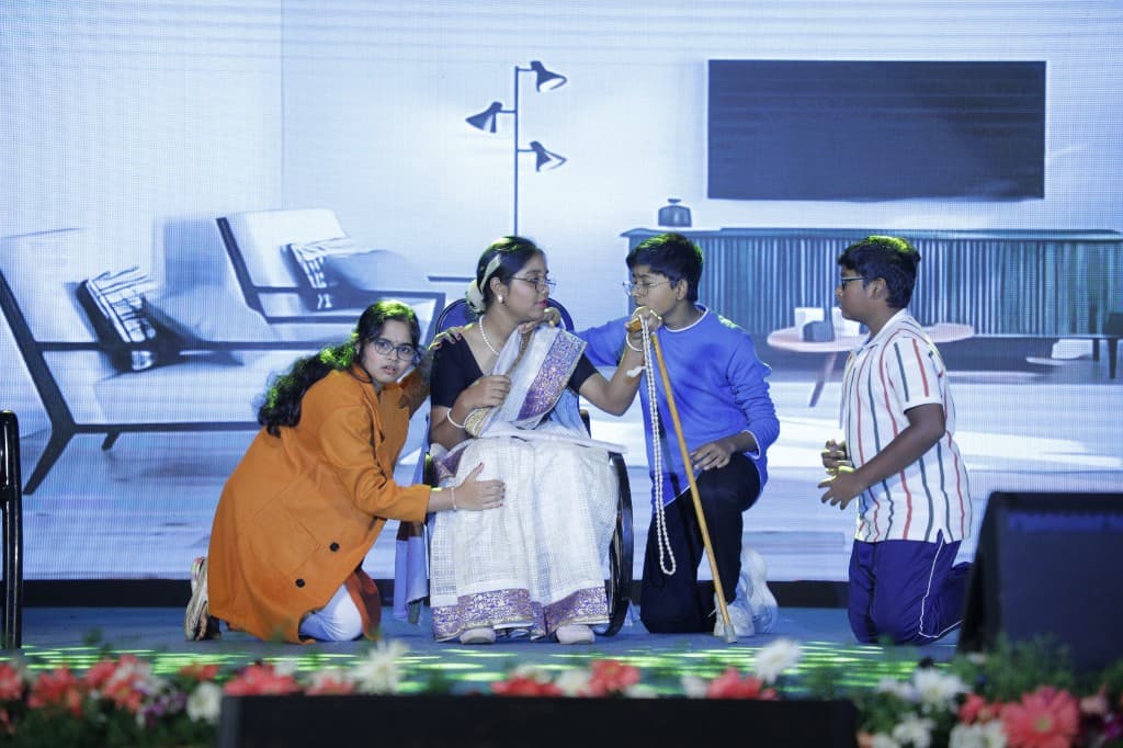High school students performing a family drama on stage at Lawrence High School