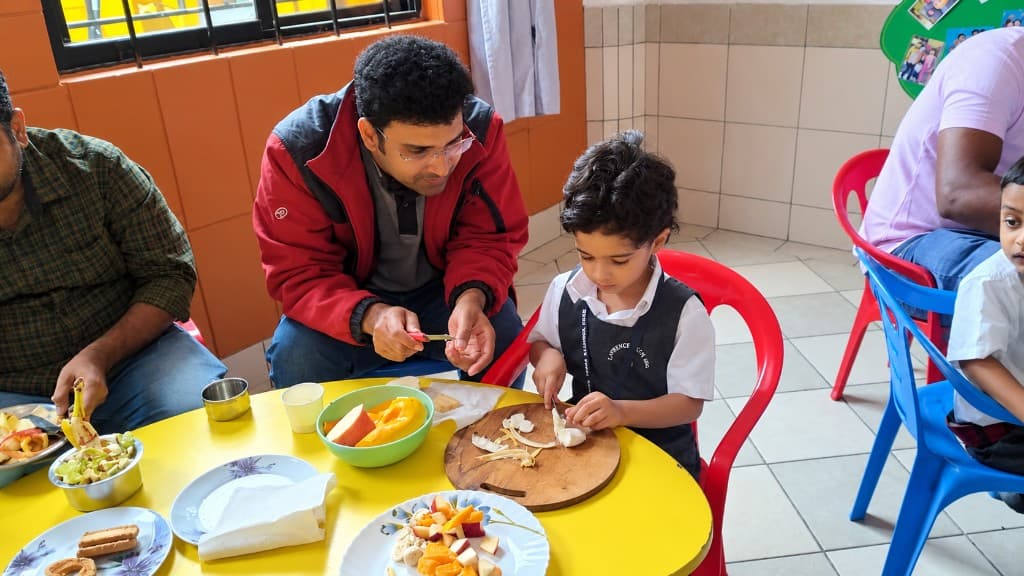 A parent and child cooking together at Lawrence High School