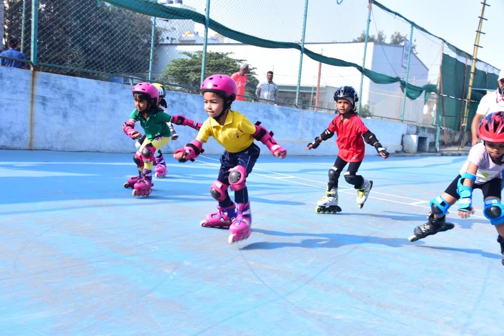 Kindergarten children skating at Lawrence High School
