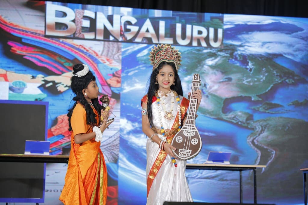 Primary students presenting Bengaluru on stage at Lawrence High School