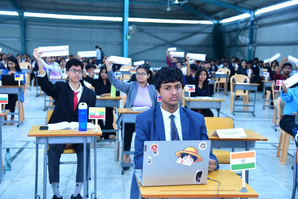 Students representing countries at a Model United Nations session