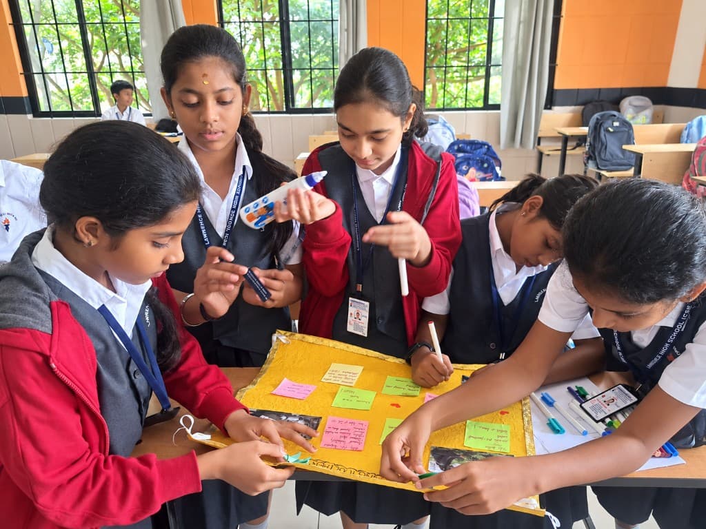 Middle school students collaborating on a classroom project