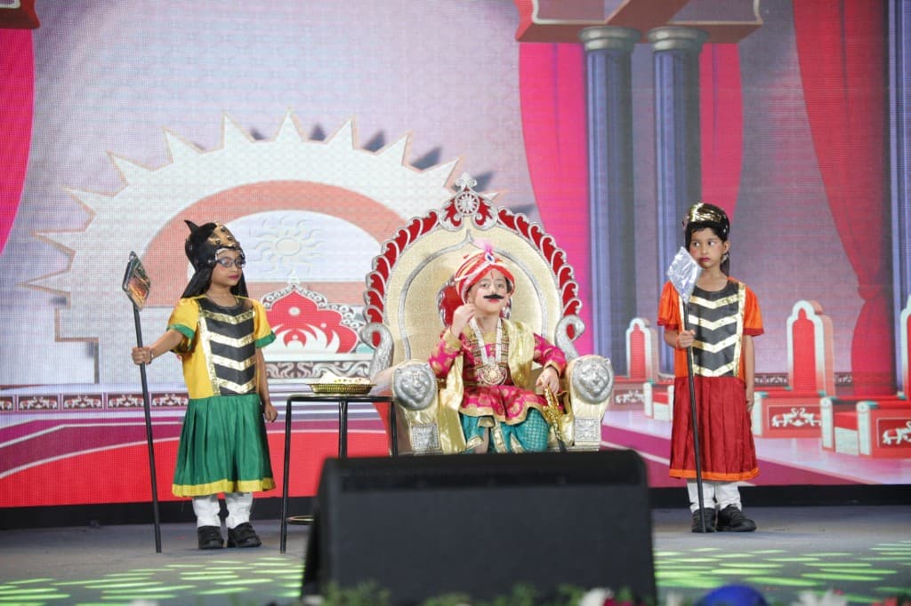 Students performing a historical drama on stage at Lawrence High School