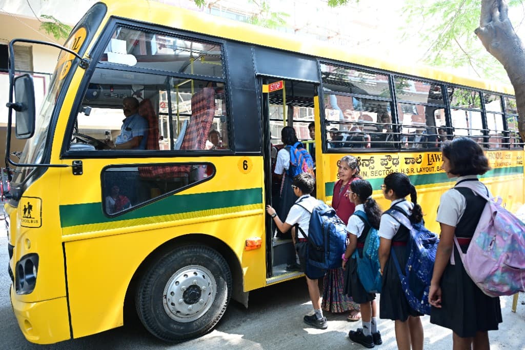 Students boarding a Lawrence High School bus