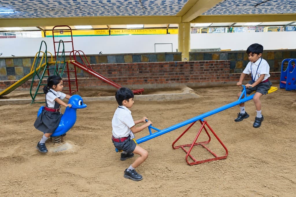 Children playing in the sandpit at Lawrence High School